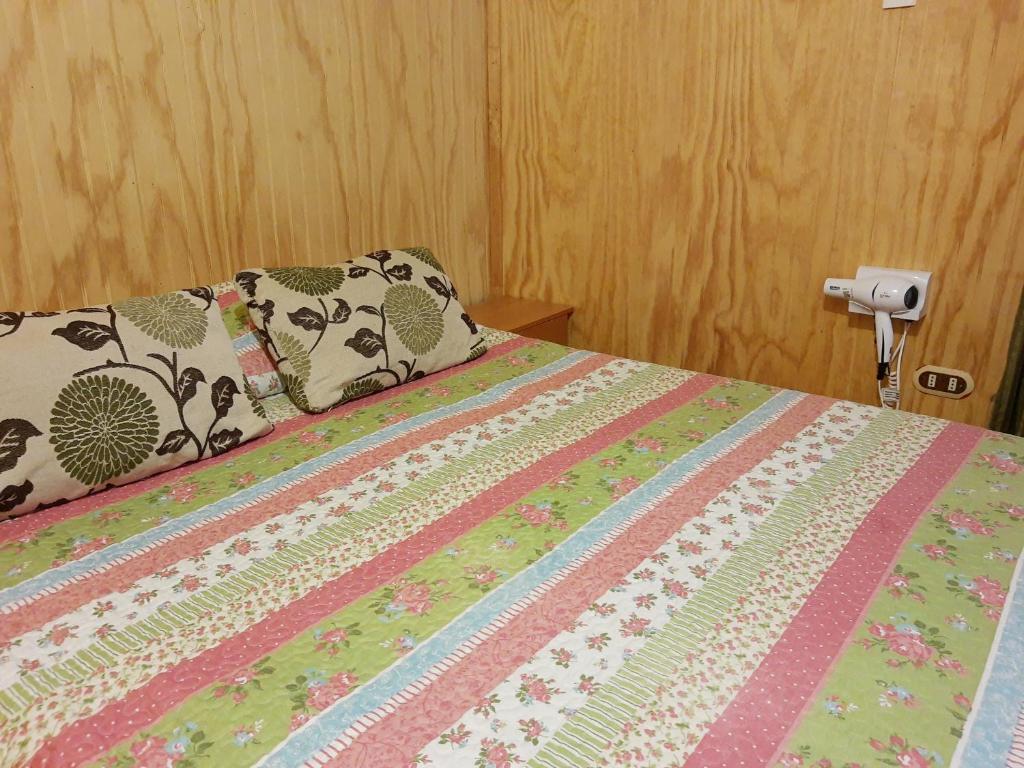 Postel nebo postele na pokoji v ubytování Departamento Hikari