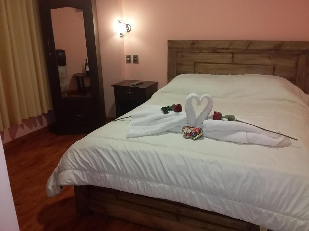 Postel nebo postele na pokoji v ubytování Hostal Nichkito