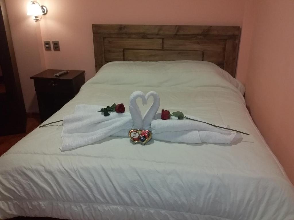 Postel nebo postele na pokoji v ubytování Hostal Nichkito