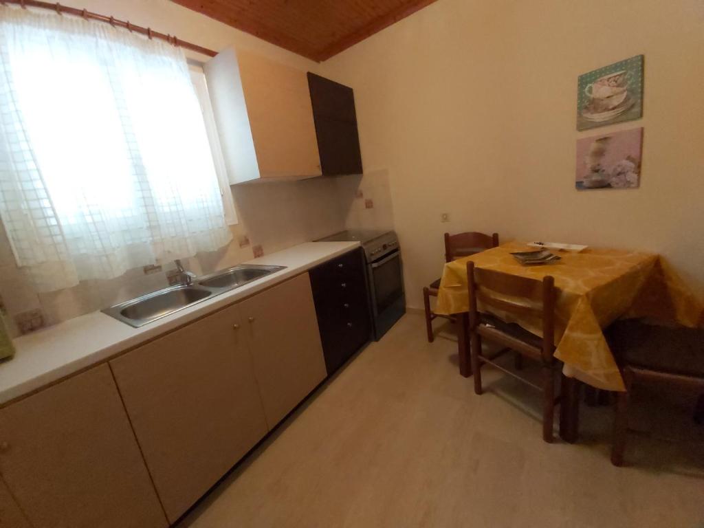 Kuchyň nebo kuchyňský kout v ubytování Eva Apartments