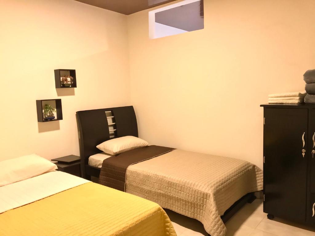 Postel nebo postele na pokoji v ubytování Casa Santa Isabel