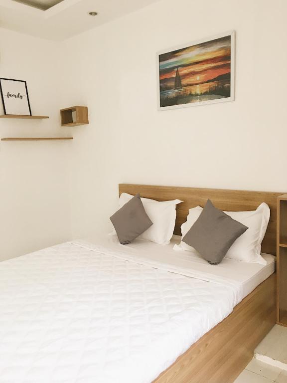 Postel nebo postele na pokoji v ubytování Hello SaiGon Homestay