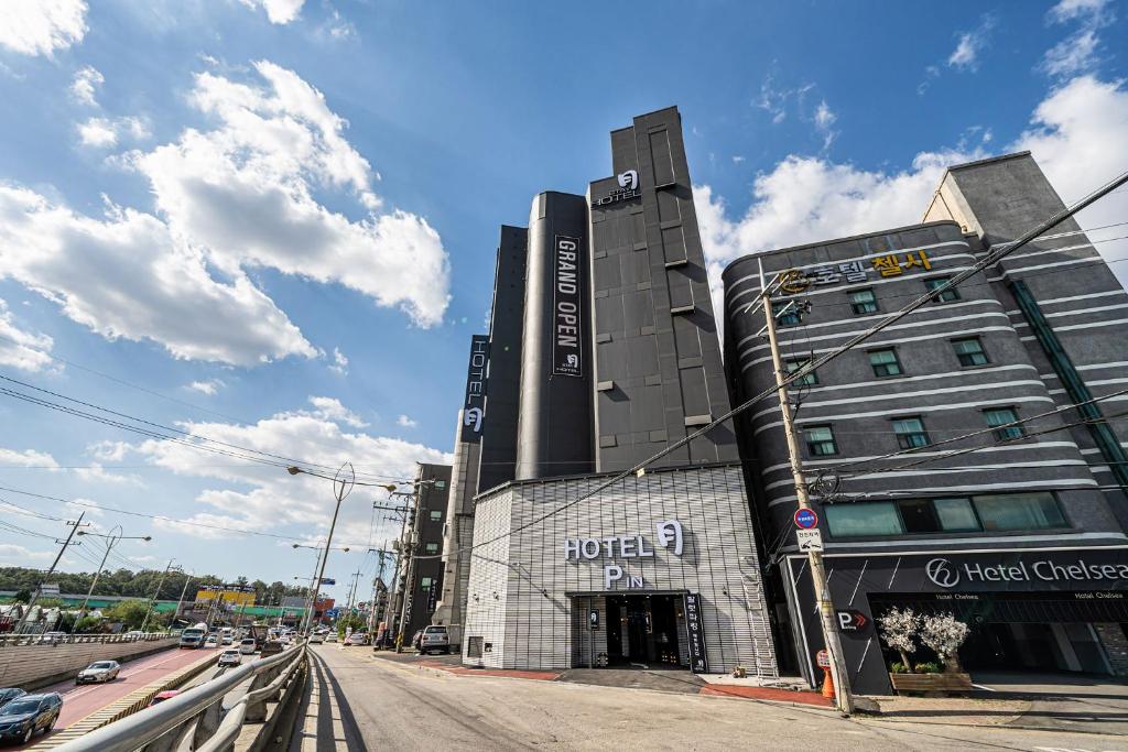 a building on the corner of a street at Stay Month Hotel in Goyang