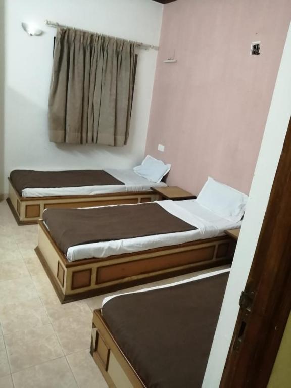 Postel nebo postele na pokoji v ubytování Hotel Damjis