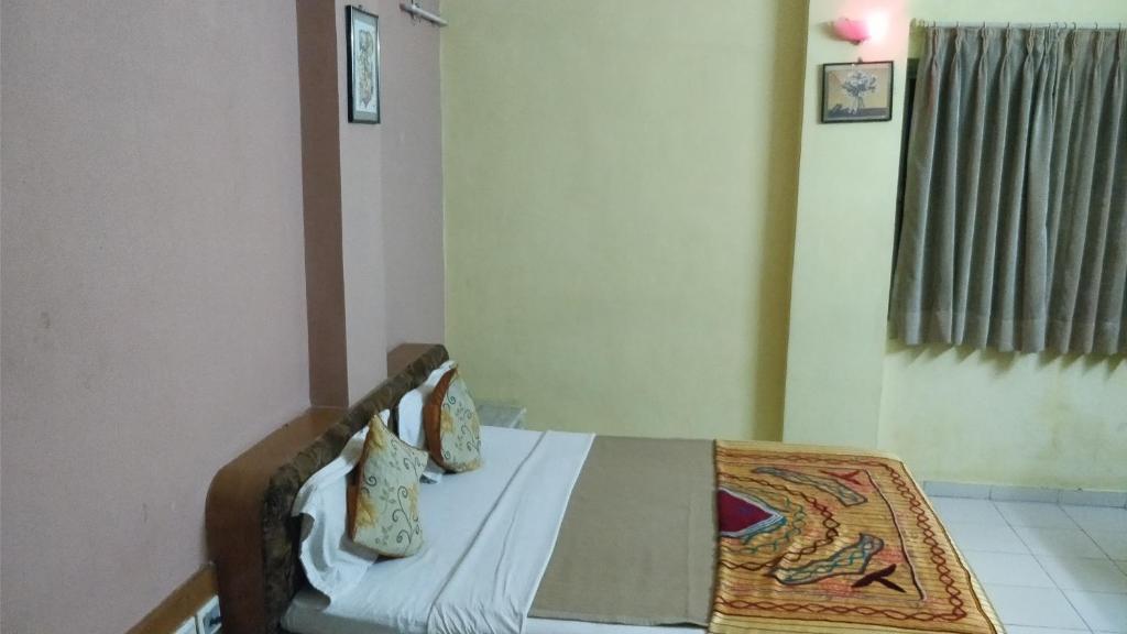 Postel nebo postele na pokoji v ubytování Hotel Damjis