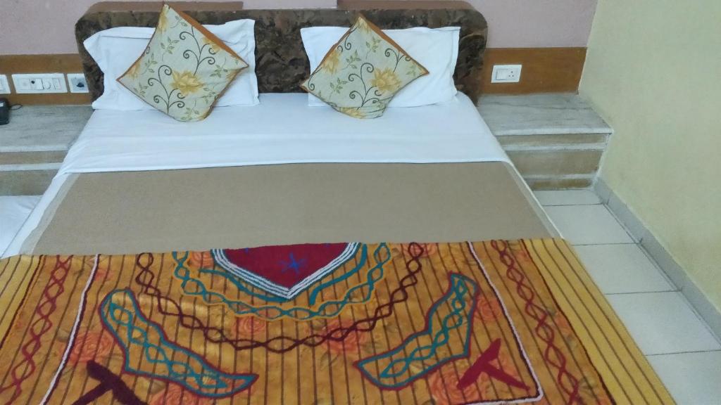 Postel nebo postele na pokoji v ubytování Hotel Damjis