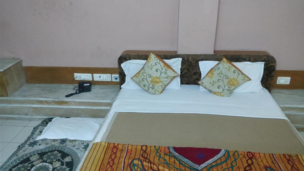 Postel nebo postele na pokoji v ubytování Hotel Damjis