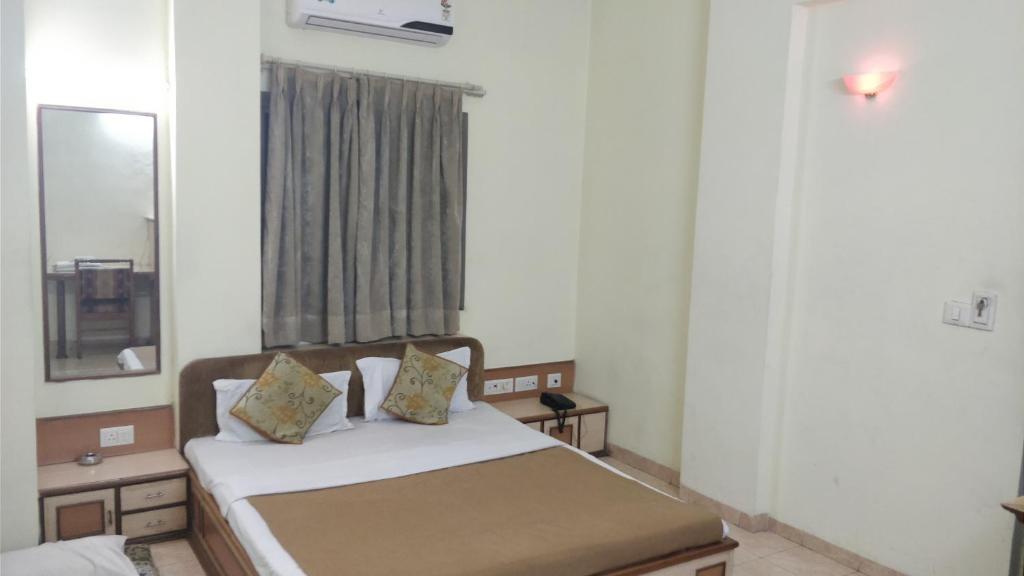 Postel nebo postele na pokoji v ubytování Hotel Damjis