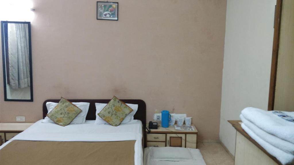 Postel nebo postele na pokoji v ubytování Hotel Damjis