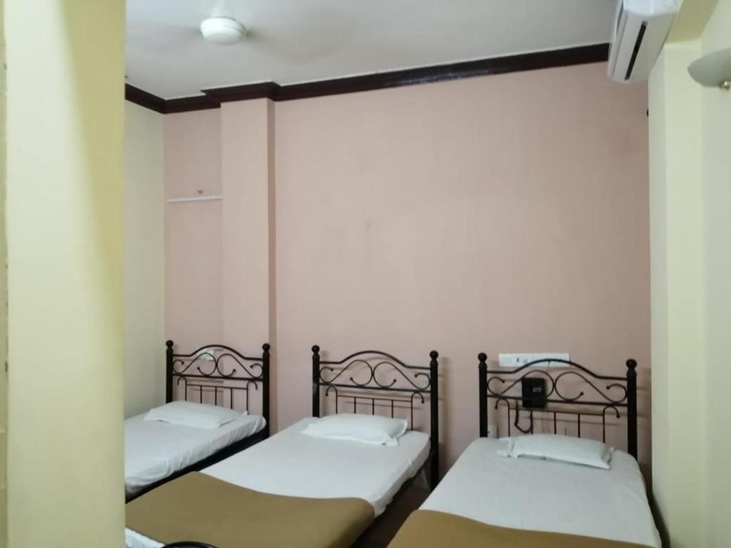 Postel nebo postele na pokoji v ubytování Hotel Damjis