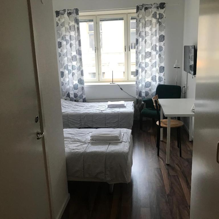 Postel nebo postele na pokoji v ubytování Nattvikens Vandrarhem