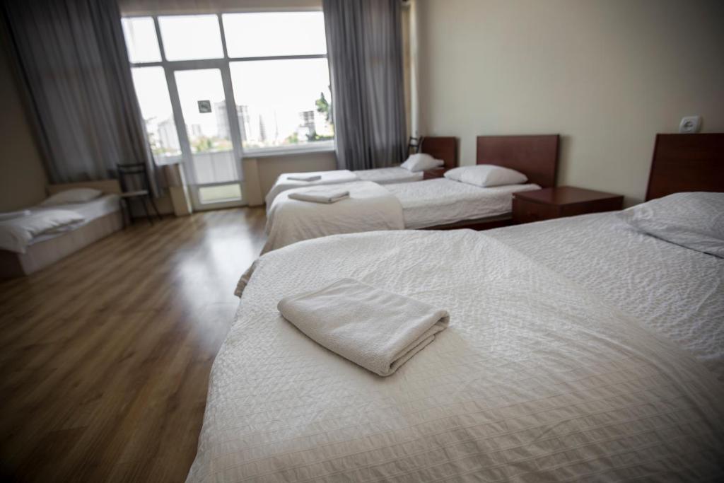 Postel nebo postele na pokoji v ubytování Ortachala Palace