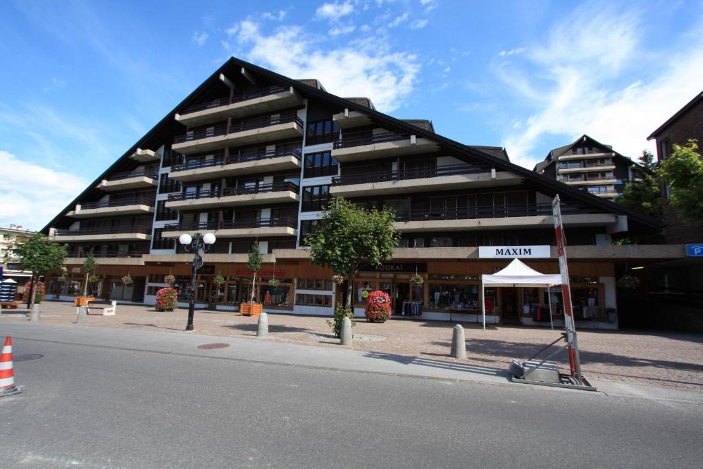 a large building on the side of a street at Apartment Victoria in Crans-Montana