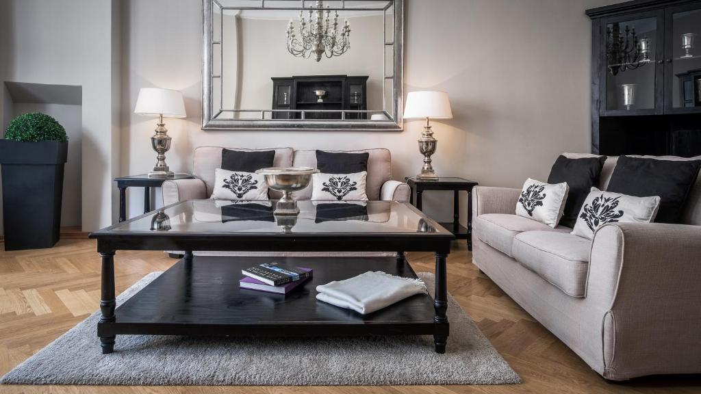 a living room with a couch and a coffee table at Palacina Berlin - Serviced Apartments in Berlin