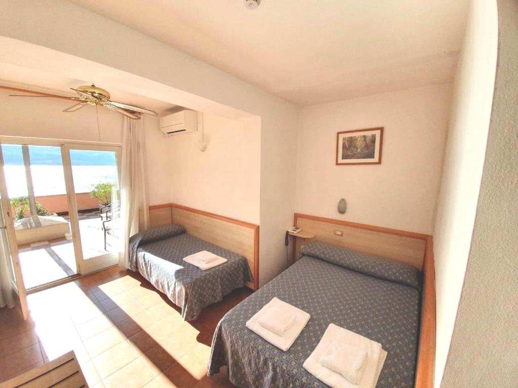 Postel nebo postele na pokoji v ubytování Hotel Castell - Montagnoli Group
