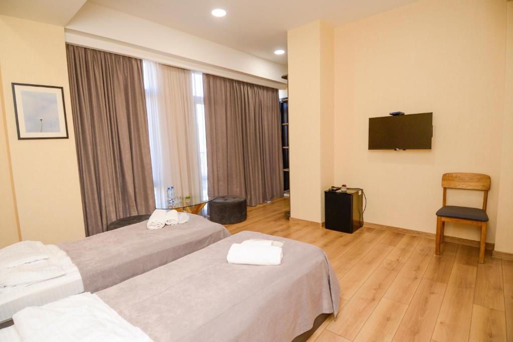 Postel nebo postele na pokoji v ubytování Hotel Avlabari Terrace