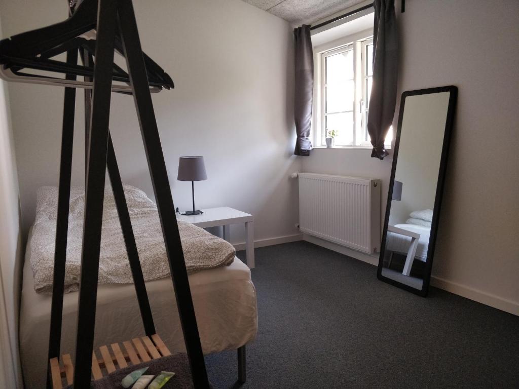 Postel nebo postele na pokoji v ubytování B & B Gødstrup - cafe og restaurant Den Gamle Stald