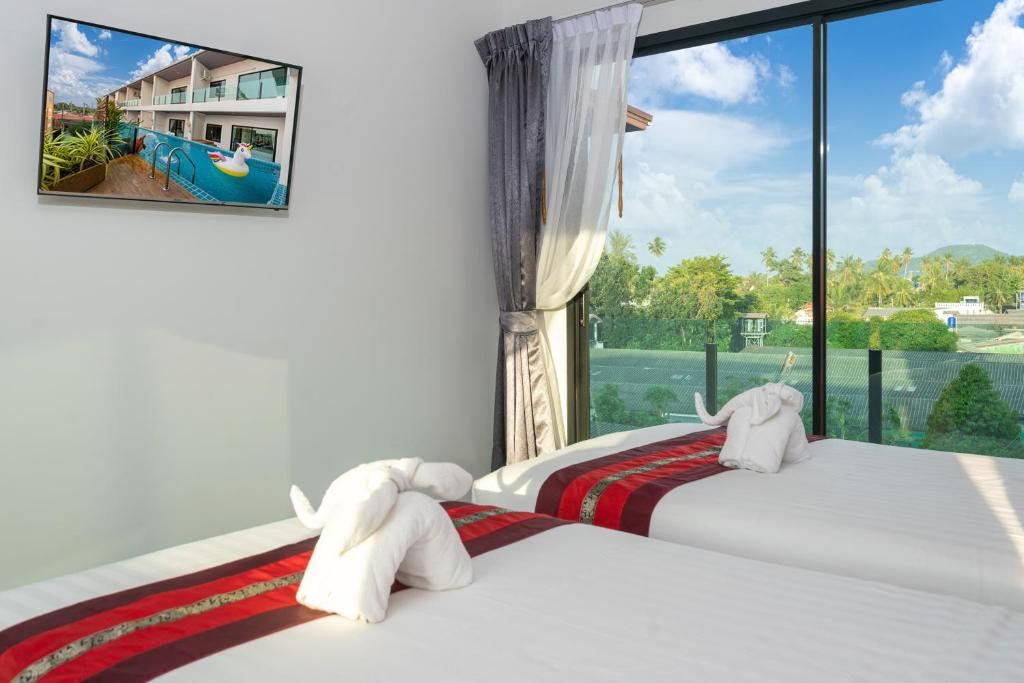 Postel nebo postele na pokoji v ubytování The Thames Pool Access Resort & Villa - SHA Extra Plus