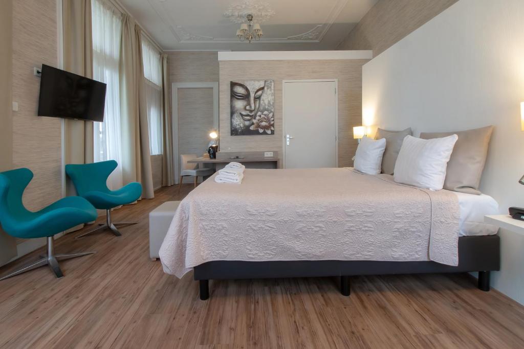 Postel nebo postele na pokoji v ubytování Hotel Andante aan Zee