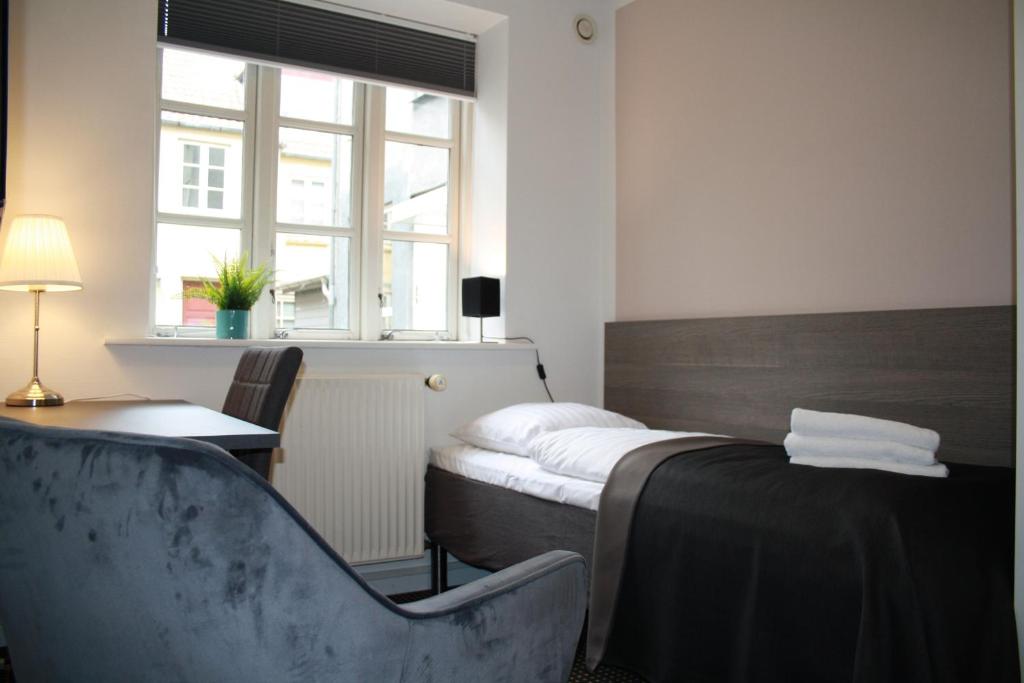 Postel nebo postele na pokoji v ubytování Hotel Aarhus City Apartments