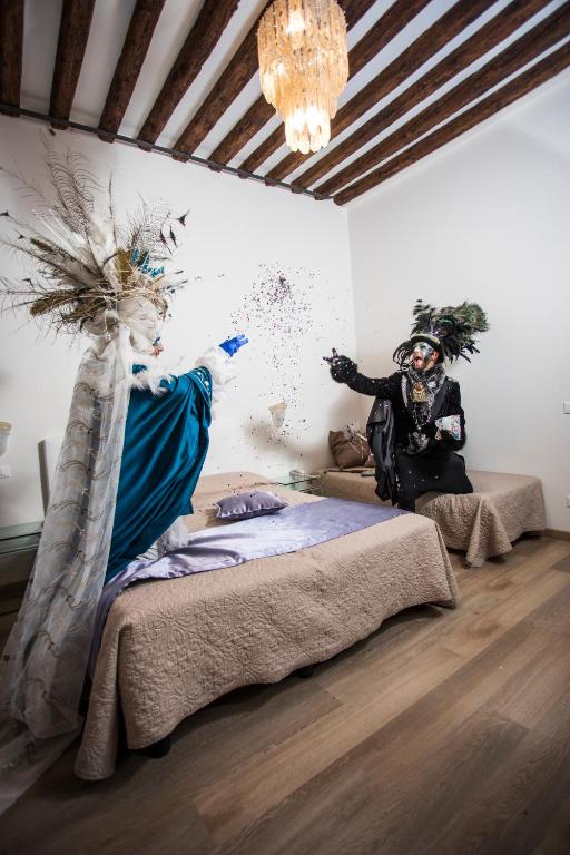 Postel nebo postele na pokoji v ubytování Locanda Ca' Lucrezia