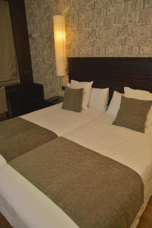 Postel nebo postele na pokoji v ubytování Hotel Gastronómico Casa Rosalia