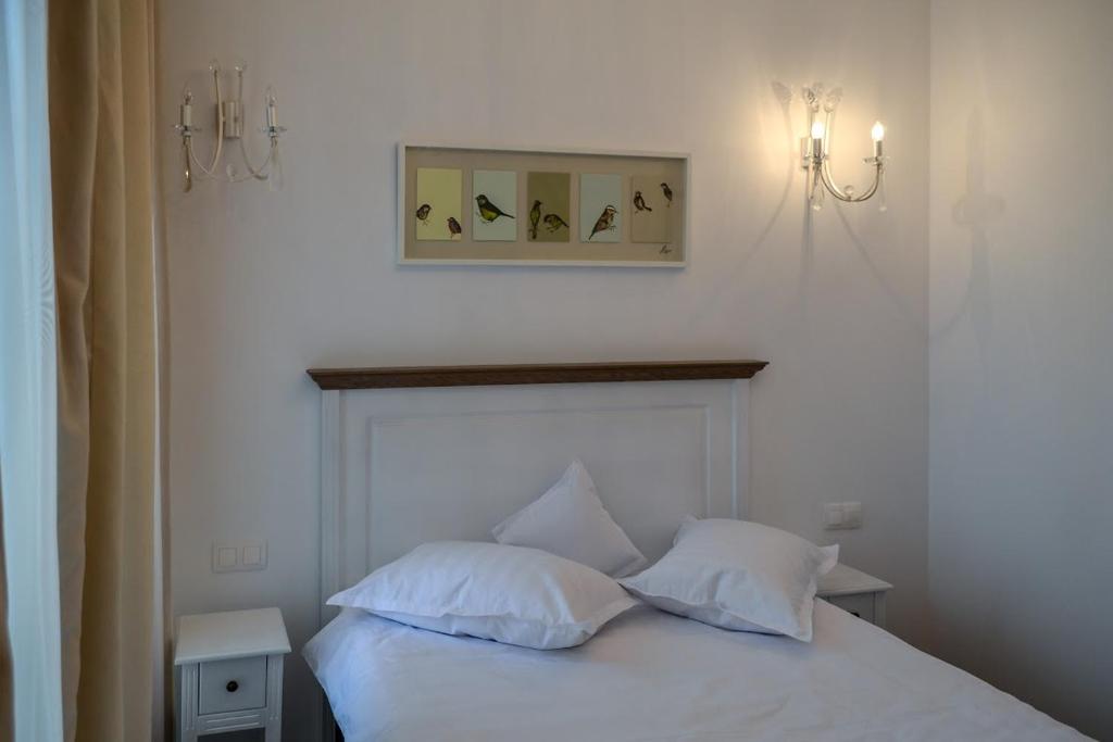 Postel nebo postele na pokoji v ubytování Hotel Coquette