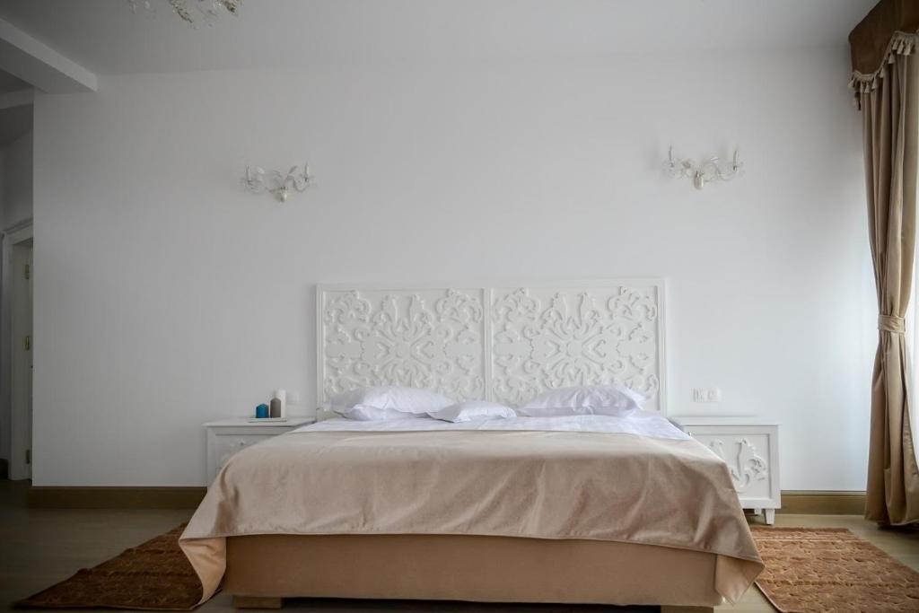 Postel nebo postele na pokoji v ubytování Hotel Coquette