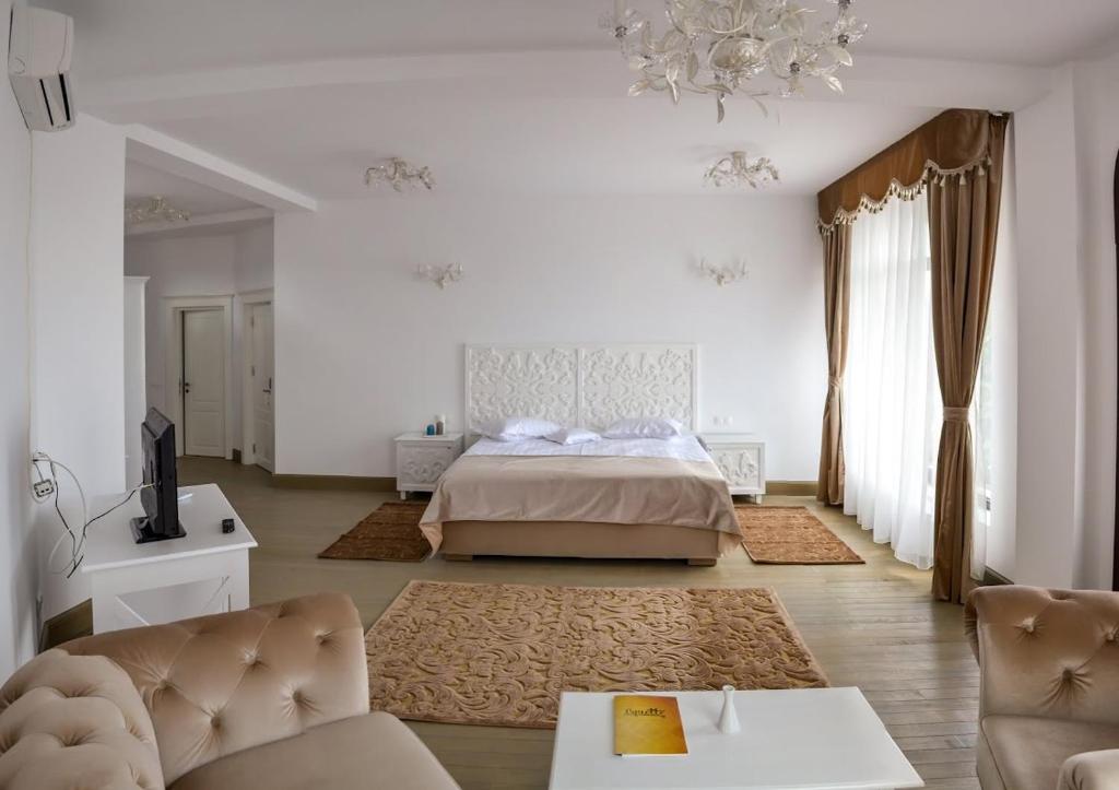 Postel nebo postele na pokoji v ubytování Hotel Coquette