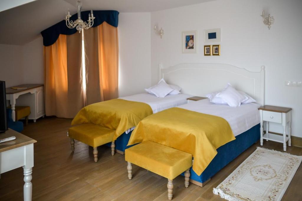 Postel nebo postele na pokoji v ubytování Hotel Coquette