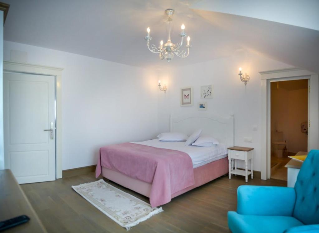 Postel nebo postele na pokoji v ubytování Hotel Coquette