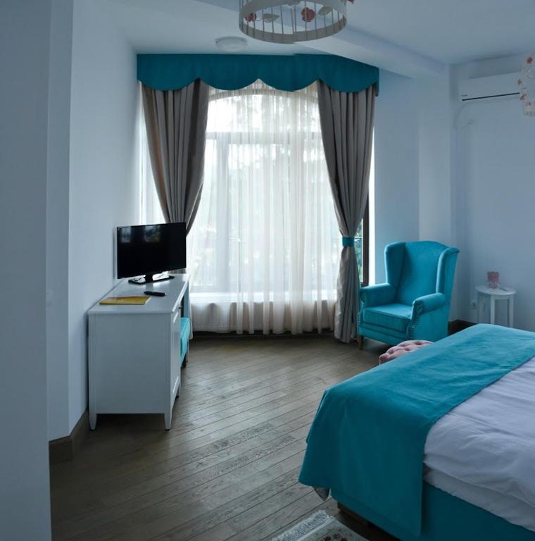 Postel nebo postele na pokoji v ubytování Hotel Coquette