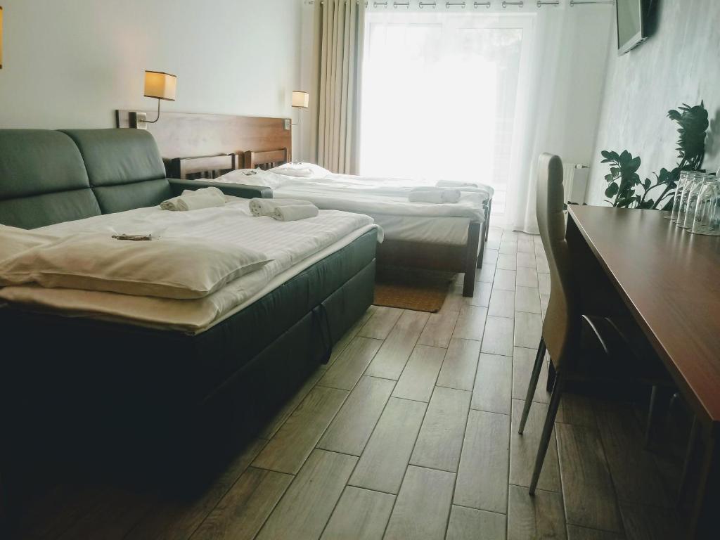 Voodi või voodid majutusasutuse Hotel Miłosz Restauracja, Basen dla dzieci, Sala Zabaw, Siłownia toas