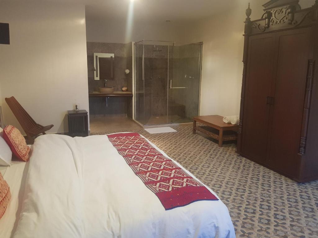 Postel nebo postele na pokoji v ubytování Hotel Maculís