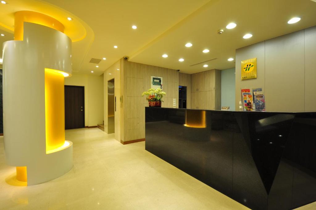 a lobby with a black and yellow counter top at Fupin Hotel in Hualien City