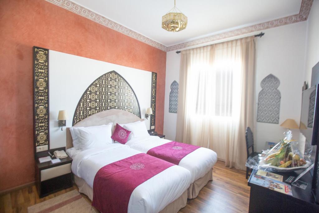 Voodi või voodid majutusasutuse El Minzah Hotel toas