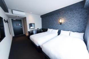 Postel nebo postele na pokoji v ubytování FP HOTELS South-Namba
