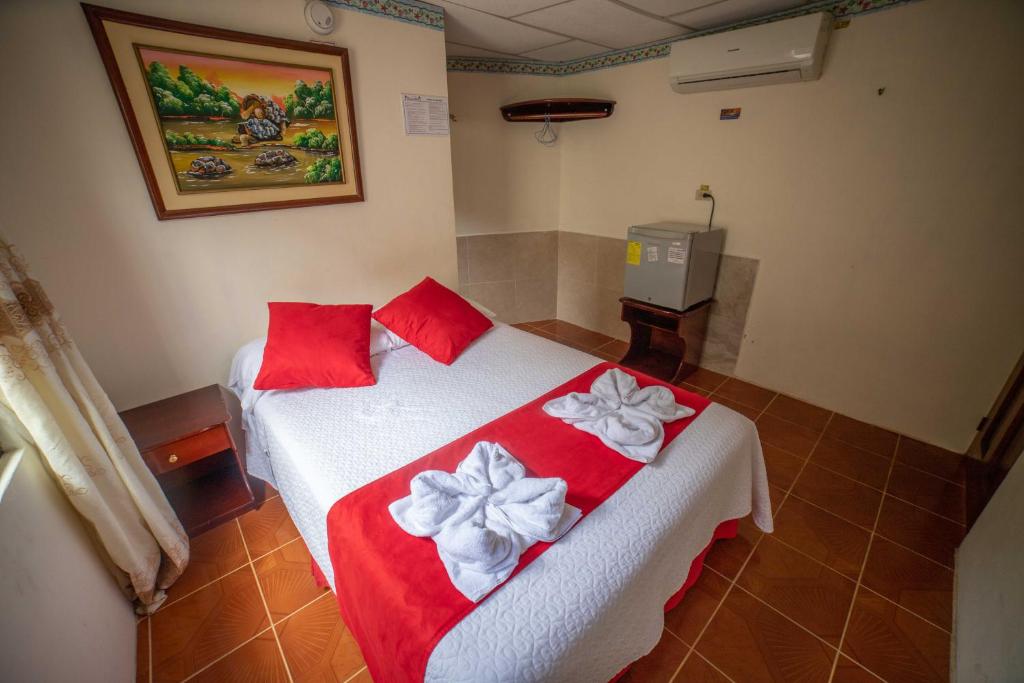 Postel nebo postele na pokoji v ubytování Hostal Gladismar