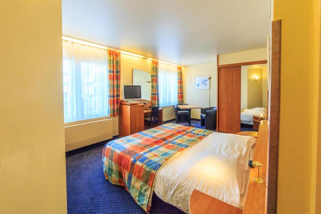 Postel nebo postele na pokoji v ubytování Hotel Pacific
