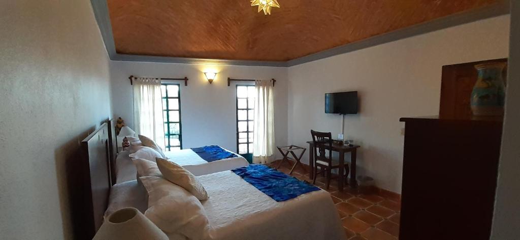 Postel nebo postele na pokoji v ubytování Casa Frida B&B