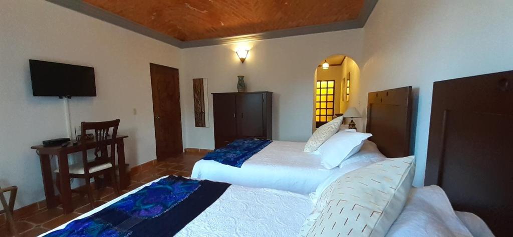 Postel nebo postele na pokoji v ubytování Casa Frida B&B