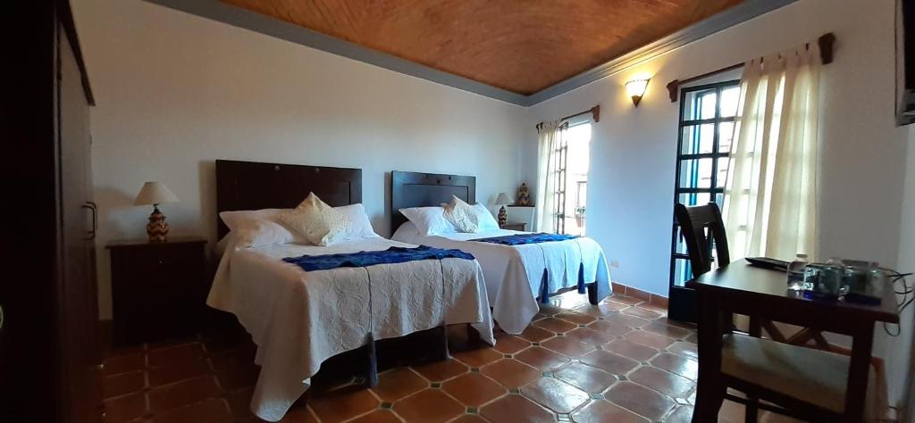 Postel nebo postele na pokoji v ubytování Casa Frida B&B