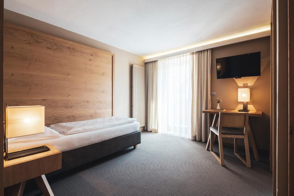 Postel nebo postele na pokoji v ubytování Hotel Arlara