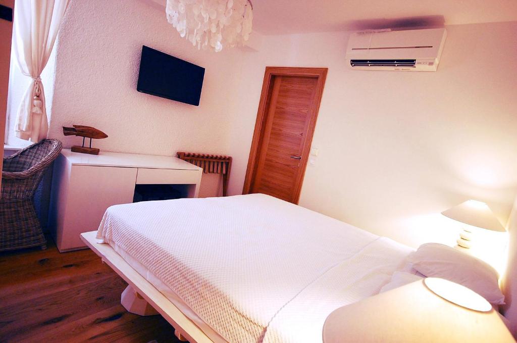 Łóżko lub łóżka w pokoju w obiekcie Boutique Hotel Placa