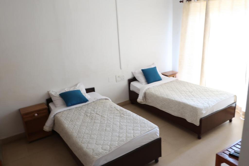 Postel nebo postele na pokoji v ubytování Zhim Zhim Guest House
