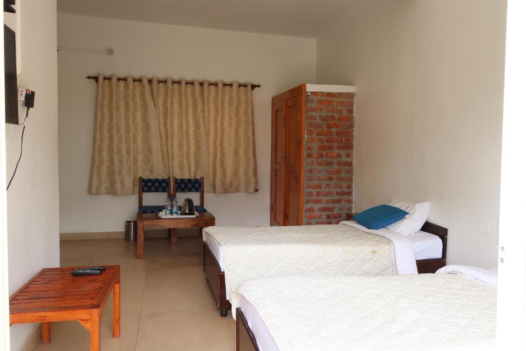 Postel nebo postele na pokoji v ubytování Zhim Zhim Guest House