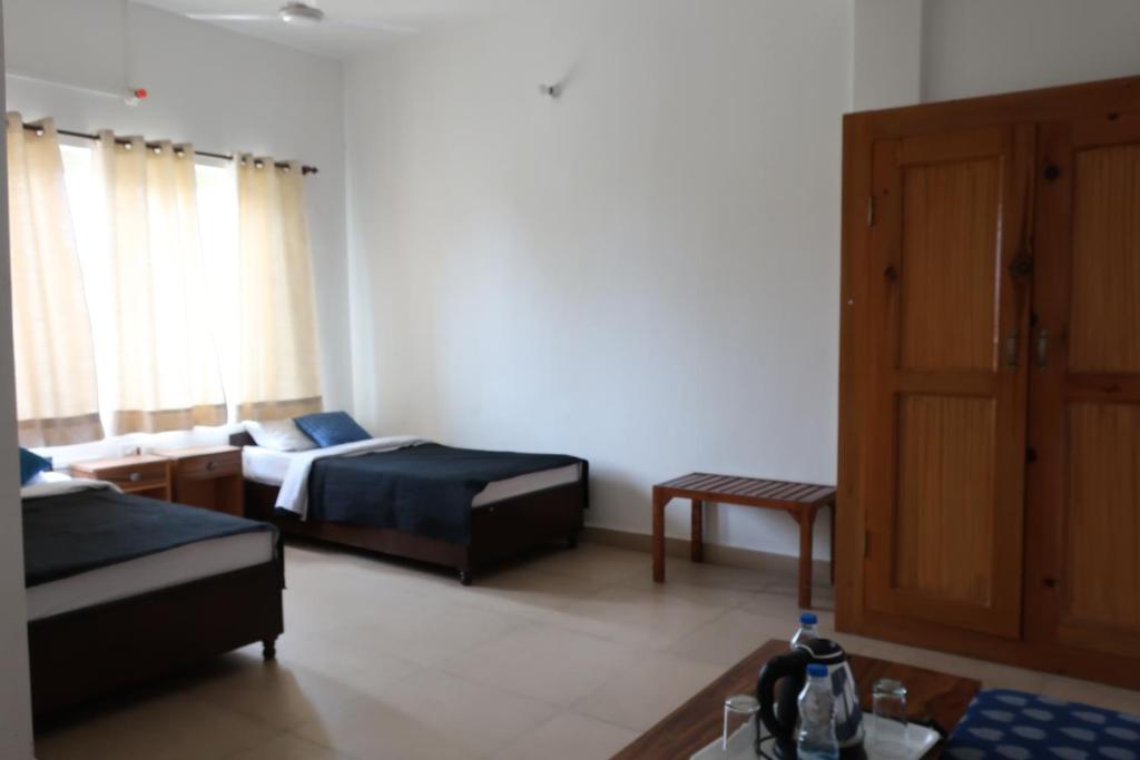 Postel nebo postele na pokoji v ubytování Zhim Zhim Guest House