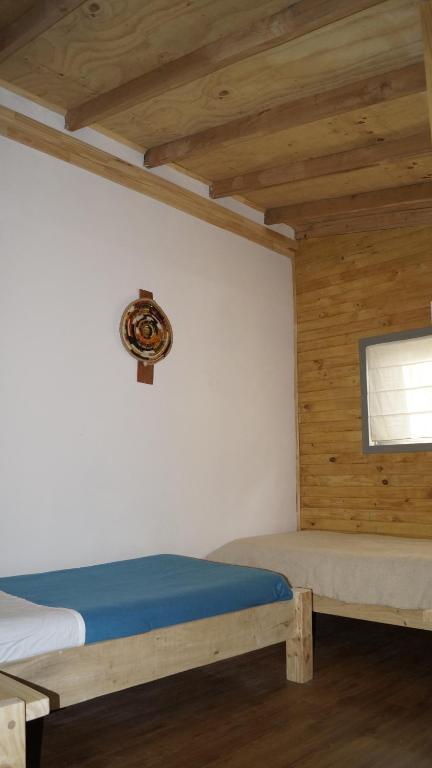 Postel nebo postele na pokoji v ubytování Posada de Expediciones Kahuel
