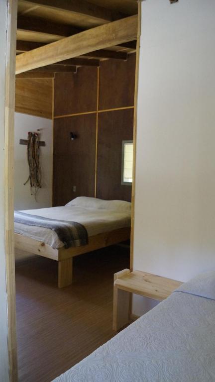 Postel nebo postele na pokoji v ubytování Posada de Expediciones Kahuel