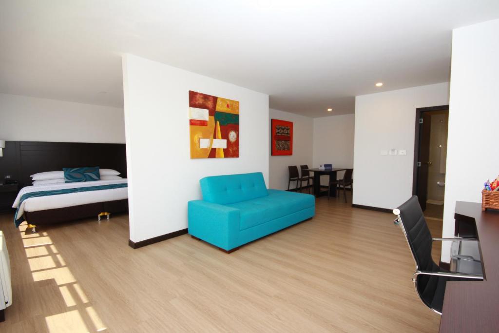 Postel nebo postele na pokoji v ubytování Hotel Dann Cali